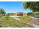 Large backyard with patio, fenced yard, storage shed and mature trees at 534 Berkley Ave, Tarpon Springs, FL 34689