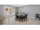 Large dining area with views of the patio through large glass doors at 534 Berkley Ave, Tarpon Springs, FL 34689