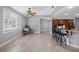 Bright dining area with tile floors, ceiling fan, and breakfast bar at 534 Berkley Ave, Tarpon Springs, FL 34689