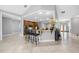 Open concept kitchen with breakfast bar, wooden cabinets, and stainless appliances at 534 Berkley Ave, Tarpon Springs, FL 34689