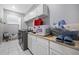 Well-organized laundry room with washer, dryer, and plenty of storage space at 534 Berkley Ave, Tarpon Springs, FL 34689