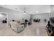 Spacious living room with tile floors, modern lighting, and access to the outdoor patio at 534 Berkley Ave, Tarpon Springs, FL 34689