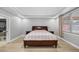 Spacious bedroom featuring neutral walls, wood floors, and two side tables at 534 Berkley Ave, Tarpon Springs, FL 34689