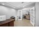 Bright office with neutral walls, tile floor, and french doors at 534 Berkley Ave, Tarpon Springs, FL 34689