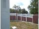 View of the property's backyard, featuring a brick and lattice fence at 5434 Fairfield S Ave # 1, Gulfport, FL 33707