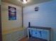 Charming hallway featuring stylish decor, including a cozy bench, elegant table, and eye-catching wall art at 5434 Fairfield S Ave # 1, Gulfport, FL 33707