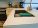 Modern kitchen sink with stylish faucet, white countertop, and sleek design, perfect for culinary enthusiasts at 5434 Fairfield S Ave # 1, Gulfport, FL 33707