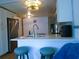 Renovated kitchen with stainless steel appliances, bright lighting, and a breakfast bar at 5434 Fairfield S Ave # 1, Gulfport, FL 33707