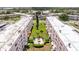 Beautiful aerial view of the condo buildings, green spaces, and courtyard at 5603 80Th N St # 107, St Petersburg, FL 33709