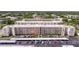 Aerial view of the condo building with parking and beautifully manicured landscaping at 5603 80Th N St # 107, St Petersburg, FL 33709