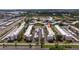 Expansive aerial view of the condominium complex and its lush green surroundings at 5603 80Th N St # 107, St Petersburg, FL 33709