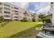 The backyard features a nice lawn and beautiful plants at 5603 80Th N St # 107, St Petersburg, FL 33709