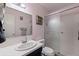 Bathroom features a single vanity, a framed mirror, and a shower with sliding glass door at 5603 80Th N St # 107, St Petersburg, FL 33709