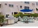 This courtyard features an outdoor grill, seating, and attractive landscaping at 5603 80Th N St # 107, St Petersburg, FL 33709