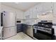 Modern kitchen equipped with stainless steel appliances and ample cabinet space at 5603 80Th N St # 107, St Petersburg, FL 33709