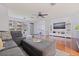 Comfortable living room with large windows, ceiling fan, and stylish decor at 5603 80Th N St # 107, St Petersburg, FL 33709