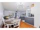 Bright living space featuring an open layout, modern lighting, and sleek, updated kitchen at 5603 80Th N St # 107, St Petersburg, FL 33709