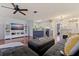 Spacious living area with an open-concept layout, connecting the living room, kitchen, and dining areas at 5603 80Th N St # 107, St Petersburg, FL 33709