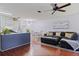 Open-concept layout connects living, dining, and kitchen spaces, with hardwood floors and modern decor at 5603 80Th N St # 107, St Petersburg, FL 33709