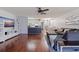 Open-concept layout connects living, dining, and kitchen spaces, with hardwood floors and modern decor at 5603 80Th N St # 107, St Petersburg, FL 33709
