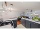 Bright living space featuring an open layout, modern lighting, and sleek, updated kitchen at 5603 80Th N St # 107, St Petersburg, FL 33709