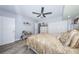 Bedroom featuring a ceiling fan, dresser, closet and light colored walls and accents at 5694 40Th N Ter # 423, Kenneth City, FL 33709