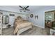 Inviting bedroom featuring a ceiling fan, wood floors and a neutral color palette at 5694 40Th N Ter # 423, Kenneth City, FL 33709