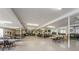 Spacious community center featuring tables, chairs, and a library for social gatherings at 5694 40Th N Ter # 423, Kenneth City, FL 33709
