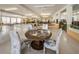 Large community center area featuring tables, chairs, and a library space for activities at 5694 40Th N Ter # 423, Kenneth City, FL 33709