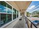 Inviting entryway featuring a well-lit walkway, sleek railing, and covered porch at 5694 40Th N Ter # 423, Kenneth City, FL 33709