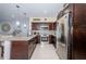 Modern kitchen features stainless steel appliances, granite countertops, and dark wood cabinetry at 5694 40Th N Ter # 423, Kenneth City, FL 33709