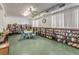 Bright library area filled with bookshelves and a seating area for reading and community engagement at 5694 40Th N Ter # 423, Kenneth City, FL 33709