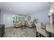 Bright living room featuring hardwood floors, modern decor, and an open layout at 5694 40Th N Ter # 423, Kenneth City, FL 33709
