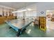 Another view of the recreation room with ping pong table, perfect for social gatherings and leisure at 5694 40Th N Ter # 423, Kenneth City, FL 33709