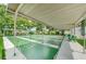 Multiple shuffleboard courts with benches under shelter, offering a perfect space for friendly competition at 5694 40Th N Ter # 423, Kenneth City, FL 33709