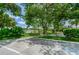 Scenic view of the shuffleboard courts, surrounded by lush greenery and inviting benches at 5694 40Th N Ter # 423, Kenneth City, FL 33709