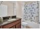 Bathroom with a tub, toilet, and vanity with a stone countertop at 5724 Shell Ridge Dr, Lithia, FL 33547