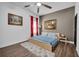Cozy bedroom with hardwood floors, neutral paint colors, and comfortable bedding at 5724 Shell Ridge Dr, Lithia, FL 33547