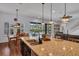 Spacious kitchen island with granite countertops and views of the backyard pool at 5724 Shell Ridge Dr, Lithia, FL 33547