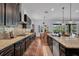 Modern kitchen features stainless steel appliances, granite countertops and dark wood cabinets at 5724 Shell Ridge Dr, Lithia, FL 33547