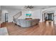 Spacious living room with hardwood floors and neutral paint colors and comfortable seating at 5724 Shell Ridge Dr, Lithia, FL 33547