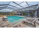 Relaxing pool area with plenty of space for seating and dining, ideal for entertaining at 5724 Shell Ridge Dr, Lithia, FL 33547