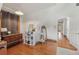 Attic space with wood floors, a storage cabinet, and doorway to the hallway at 5817 Myrtle Ln, Tampa, FL 33625