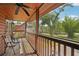 Relaxing back porch with ceiling fan, comfortable chairs, and a view of the yard at 5817 Myrtle Ln, Tampa, FL 33625