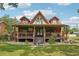 A-frame cabin features a spacious covered deck perfect for outdoor living and entertainment at 5817 Myrtle Ln, Tampa, FL 33625