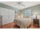 Comfortable bedroom with hardwood floors, a ceiling fan and closet at 5817 Myrtle Ln, Tampa, FL 33625