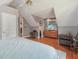 Spacious bedroom showcasing sloped ceilings and hardwood floors at 5817 Myrtle Ln, Tampa, FL 33625