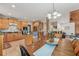 Bright dining area with hardwood floors, an open floor plan, and flowers as a centerpiece for the table at 5817 Myrtle Ln, Tampa, FL 33625