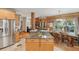Kitchen island that opens to a dining area with gorgeous wood flooring and lots of natural light at 5817 Myrtle Ln, Tampa, FL 33625