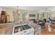 Open kitchen view leading to the inviting living room with comfortable seating and natural light at 5817 Myrtle Ln, Tampa, FL 33625